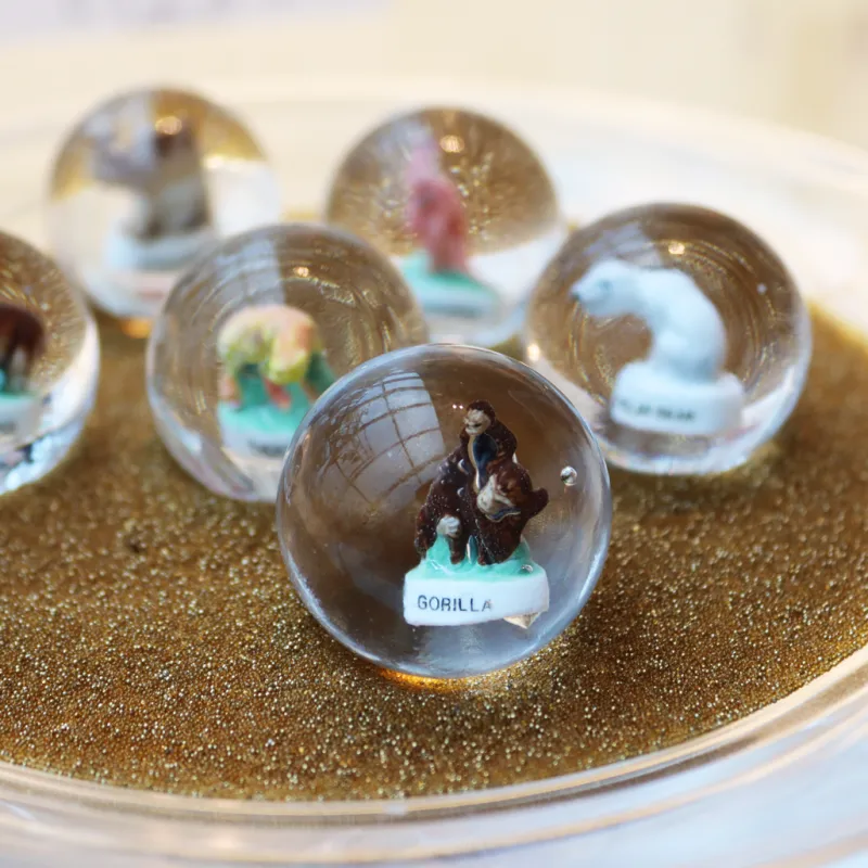 Nuggets & Murmeln^Cristalica Kingdom Murmeln mit Tierfiguren (30mm)